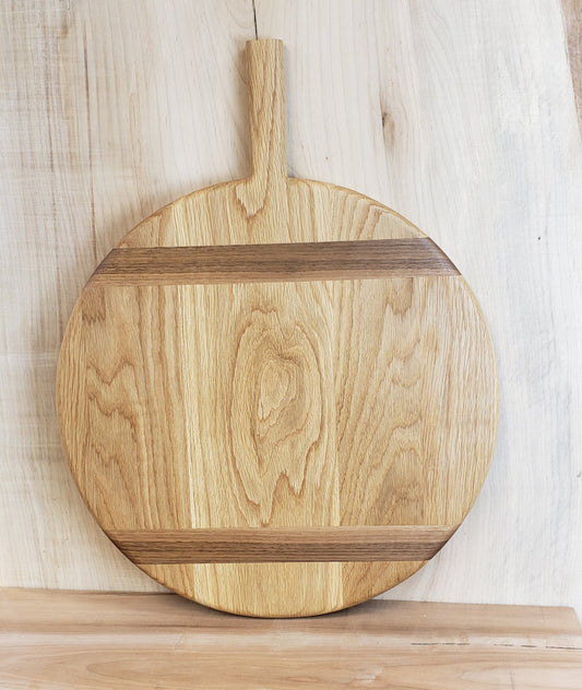 Large round white oak charcuterie board with walnut inlay.