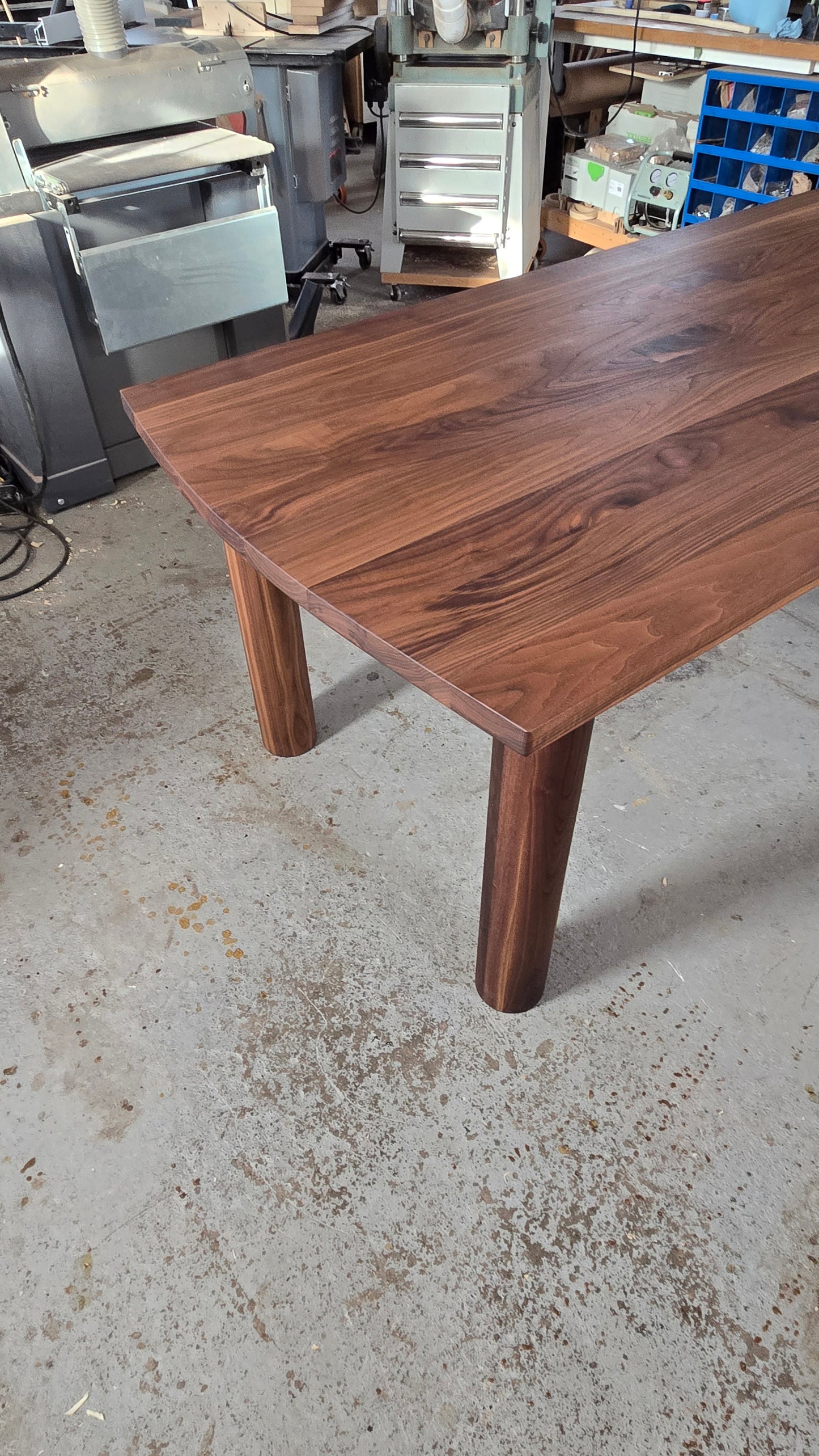 Pillars walnut dining table